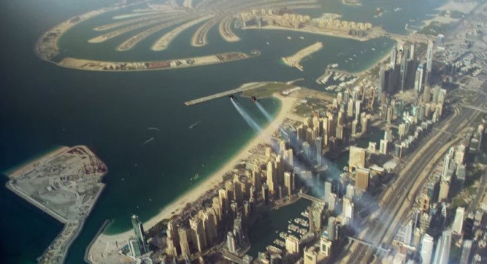 Watch two men fly over Dubai with jetpacks, Yves Rossy and Vince Reffet.