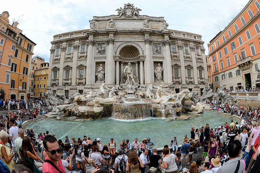 Trevi fountain in Rome during high and low season.